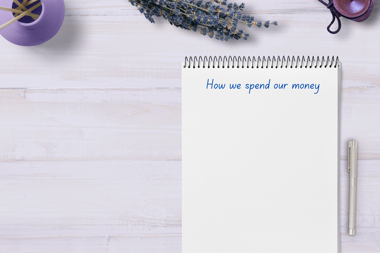 Notepad with title 'How we spend our money'